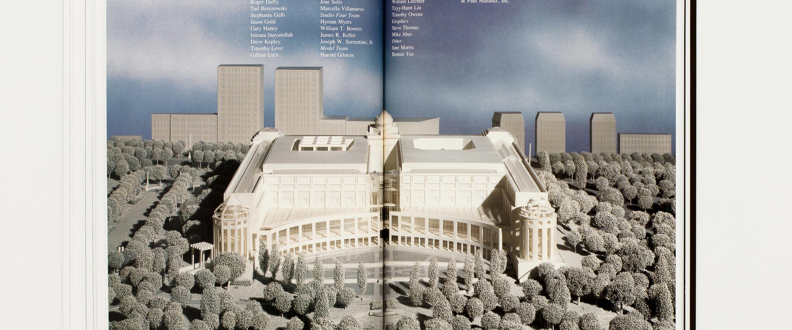 Open book displaying an architectural model with a large, neoclassical building surrounded by trees, set against a backdrop of blue sky and modern high-rise buildings.
