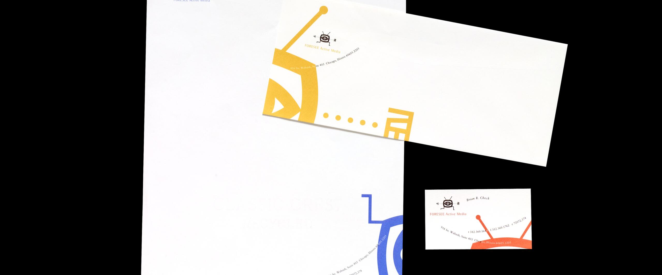 Stationery set with a letterhead, envelope, and business card featuring the FORESEE Active Media logo and colorful abstract designs in yellow, blue, and red on a black background.