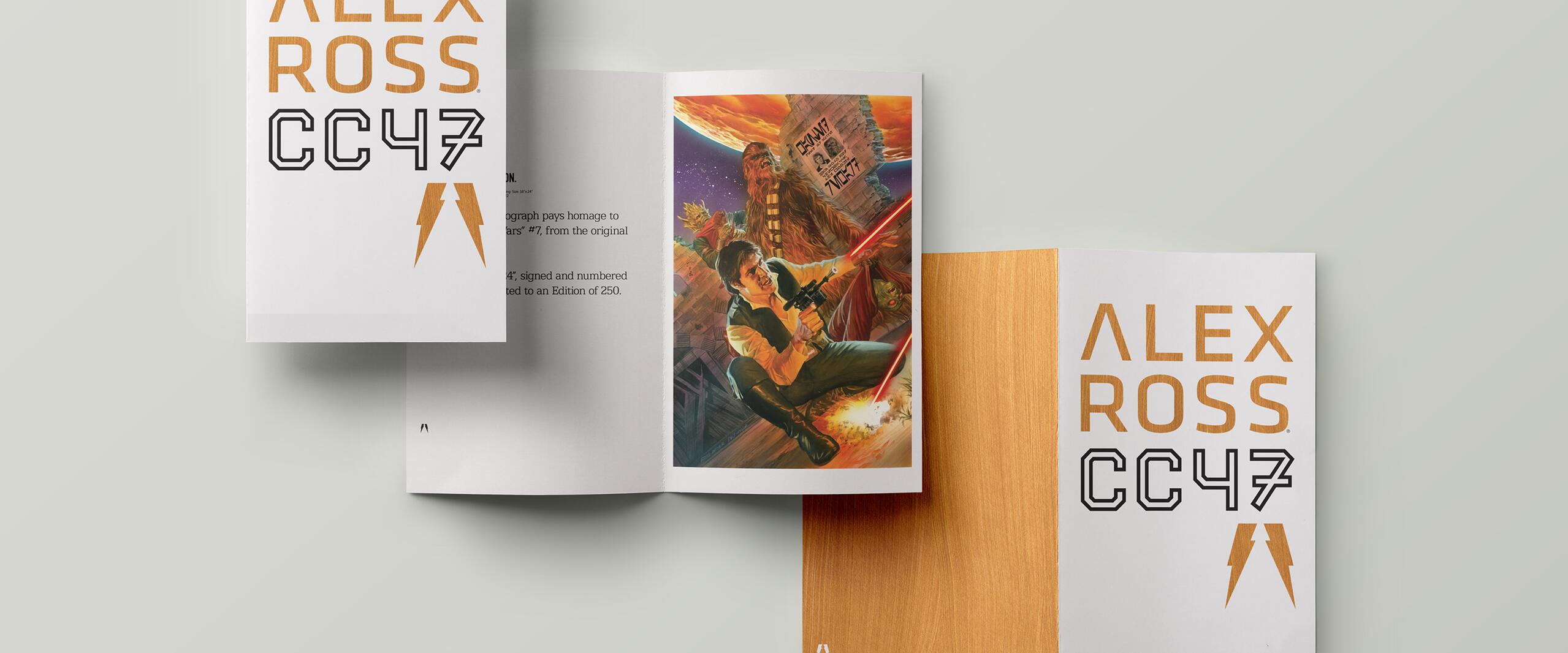 Books with "Alex Ross CC47" on the cover; one open, displaying a colorful illustration of two figures with a galactic backdrop. The setting is clean and minimal with a light gray background.