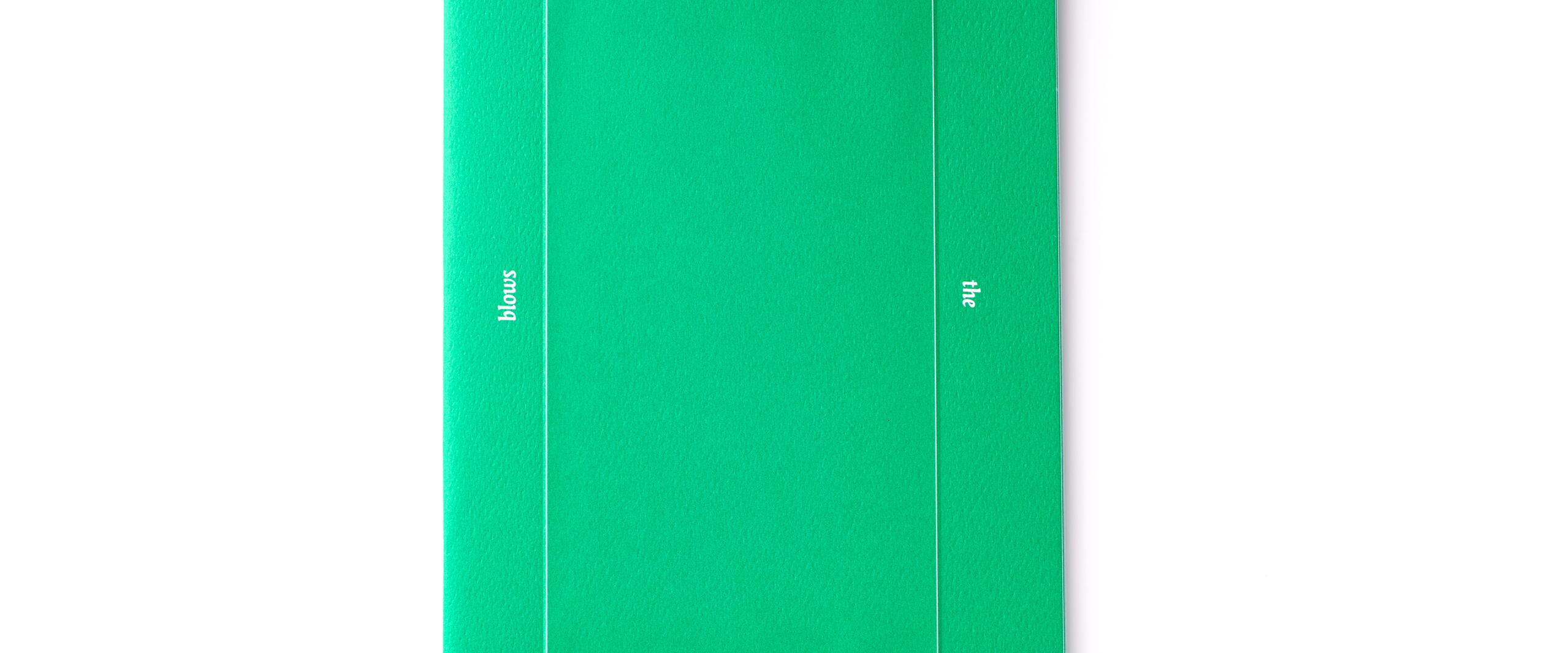 Green booklet with white text arranged around a rectangle, reading "Where the wind blows."