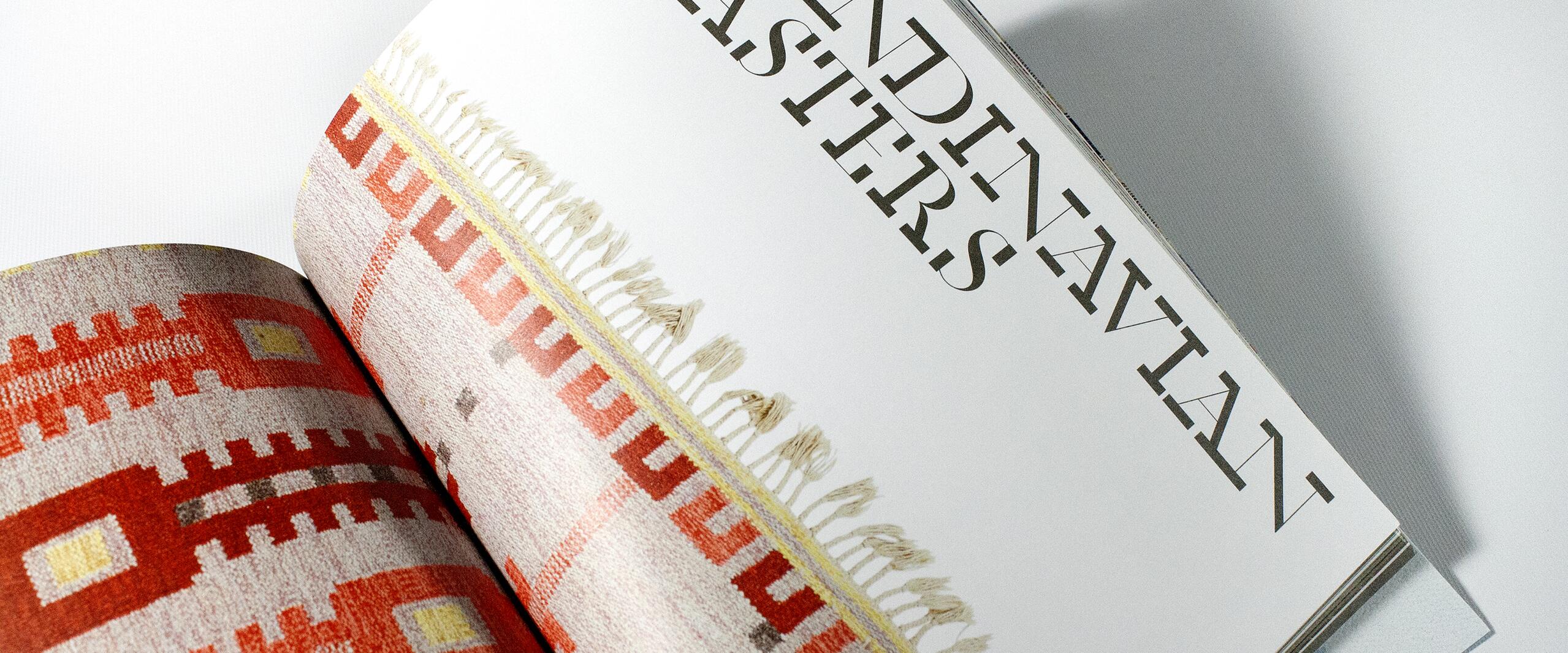 Open magazine showing a page with "SCANDINAVIAN MASTERS" in bold letters, next to a colorful woven textile with geometric patterns in red, orange, and yellow.