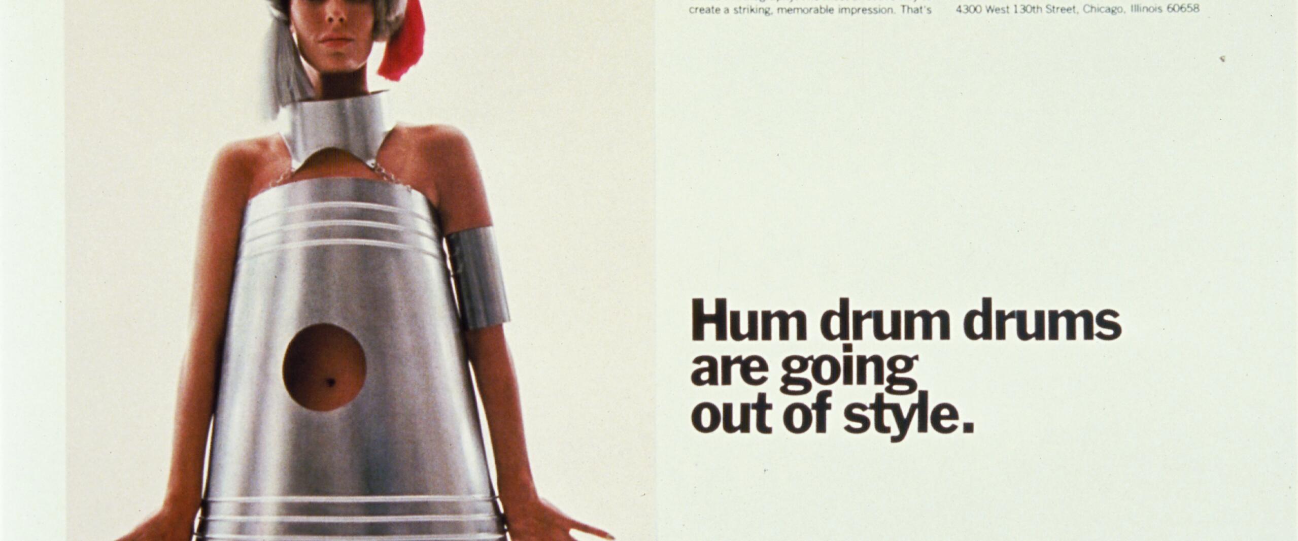 A woman stands wearing a metallic, drum-shaped dress with a circular cutout at the navel. Text beside her reads "Hum drum drums are going out of style." Inland Steel Container logo is at the bottom.